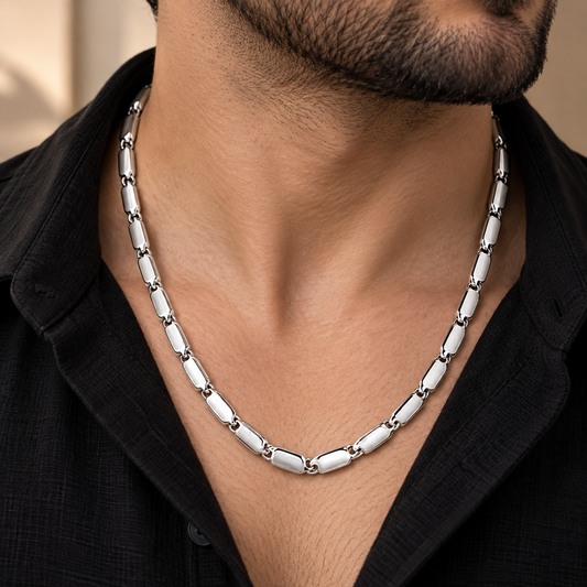 Men’s platinum chain featuring a smooth rounded box link design displayed on a black bust