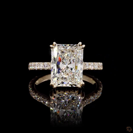 radiant and round cut lab grown diamond ring yellow gold