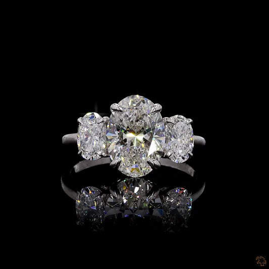 White gold lab grown diamond three stone ring 5.01 carat oval cut