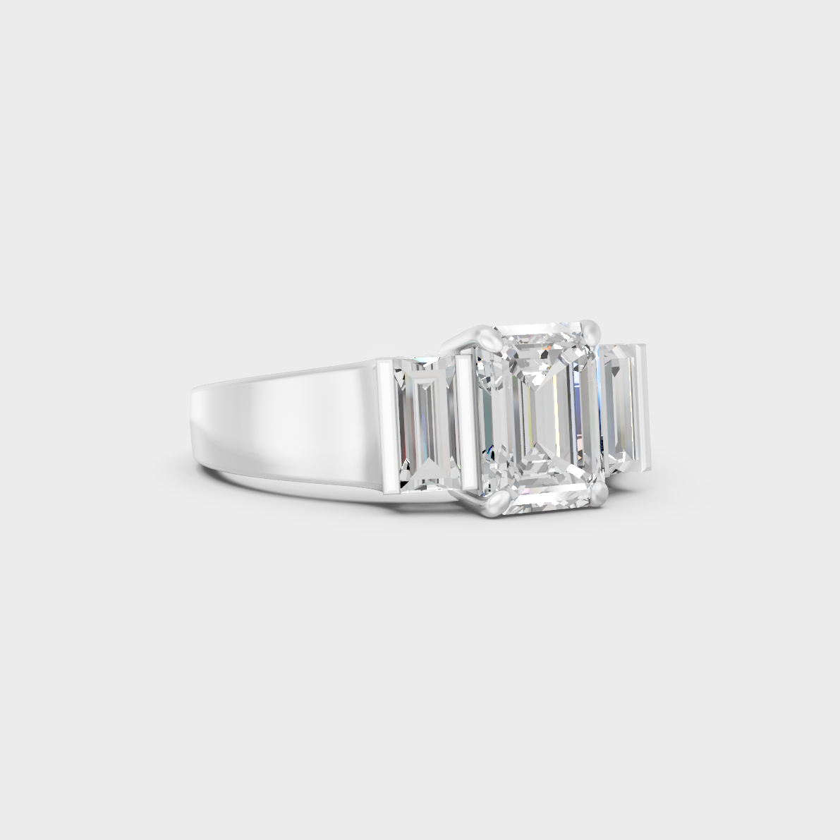 Modern 2.2 Carat Emerald and Baguette-Cut Lab-Grown Diamond Three-Stone Ring in a sleek 9K White Gold design.