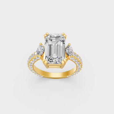 Close up detail of emerald round and marquise cut lab diamonds on yellow gold band