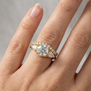 Gold and diamond ring on a hand