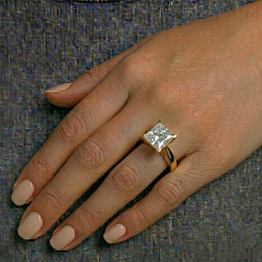 yellow gold engagement ring featuring a princess