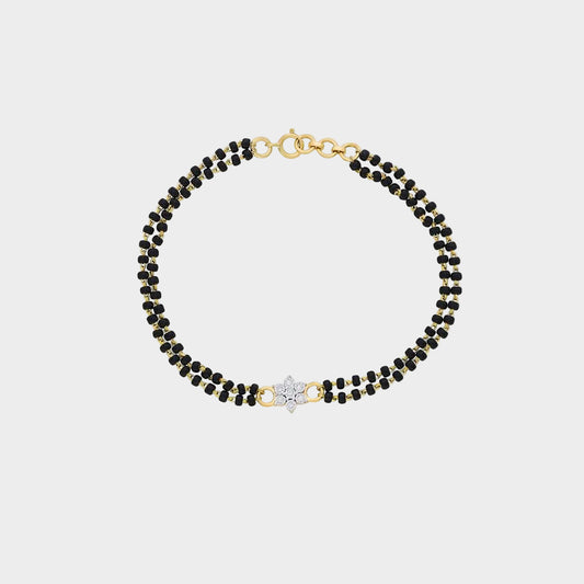 Classic yellow gold Mangalsutra bracelet featuring a round lab diamond