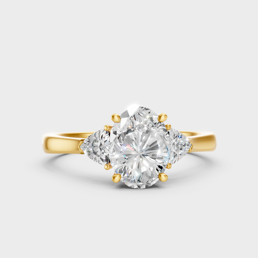Classic Yellow Gold Three-Stone Engagement Ring Featuring An Oval Cut And Trillions