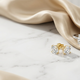Global trends in lab-grown diamond engagement rings, stud earrings, tennis bracelet, and pendant on champagne silk for Inasha Diamonds blog header.