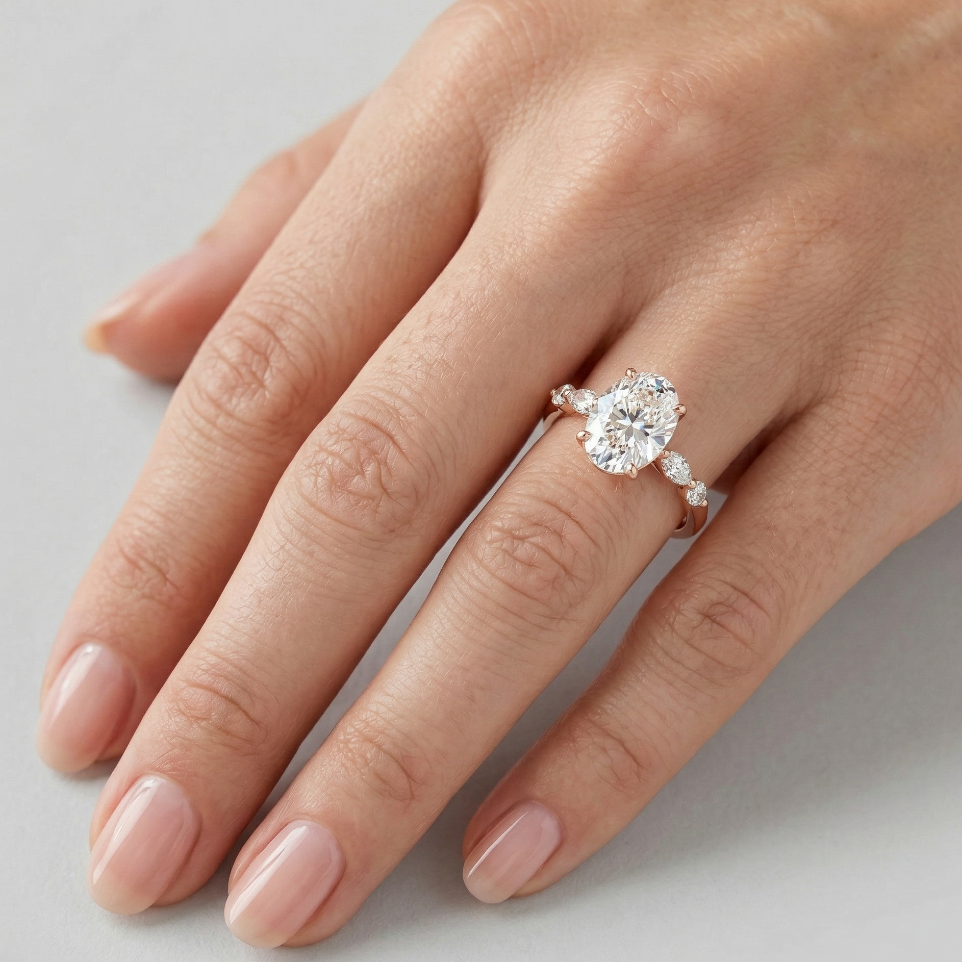 Rose Gold Ring Featuring A Igi Certified Oval-Cut And Marquise Side 