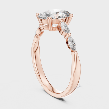 Rose gold ring with a central diamond and smaller side stones 