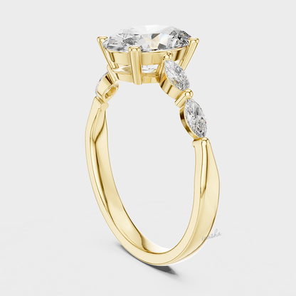 Gold ring with a central diamond and smaller side stones 