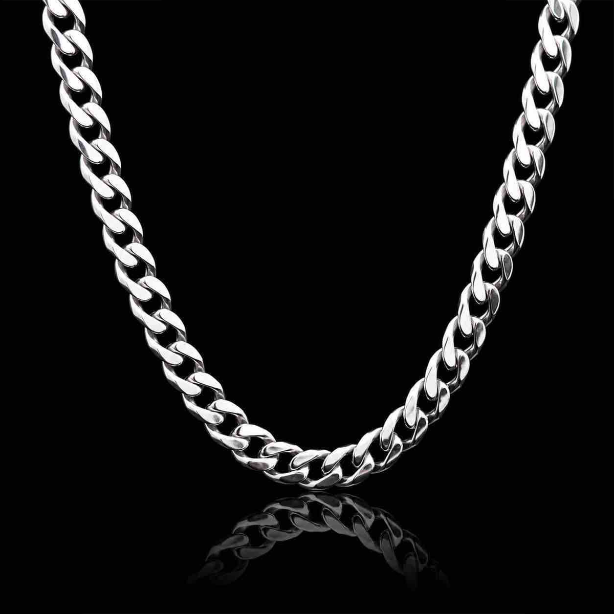 Men’s platinum chain featuring a classic curb link design against a dark studio background