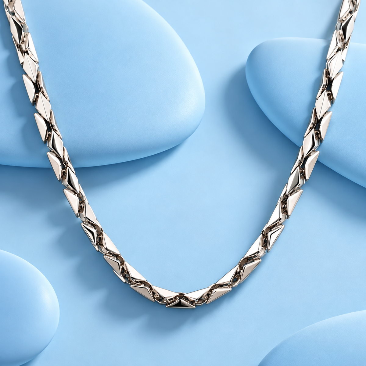 Close-up view of a faceted geometric link platinum chain necklace for men in genuine 950 platinum