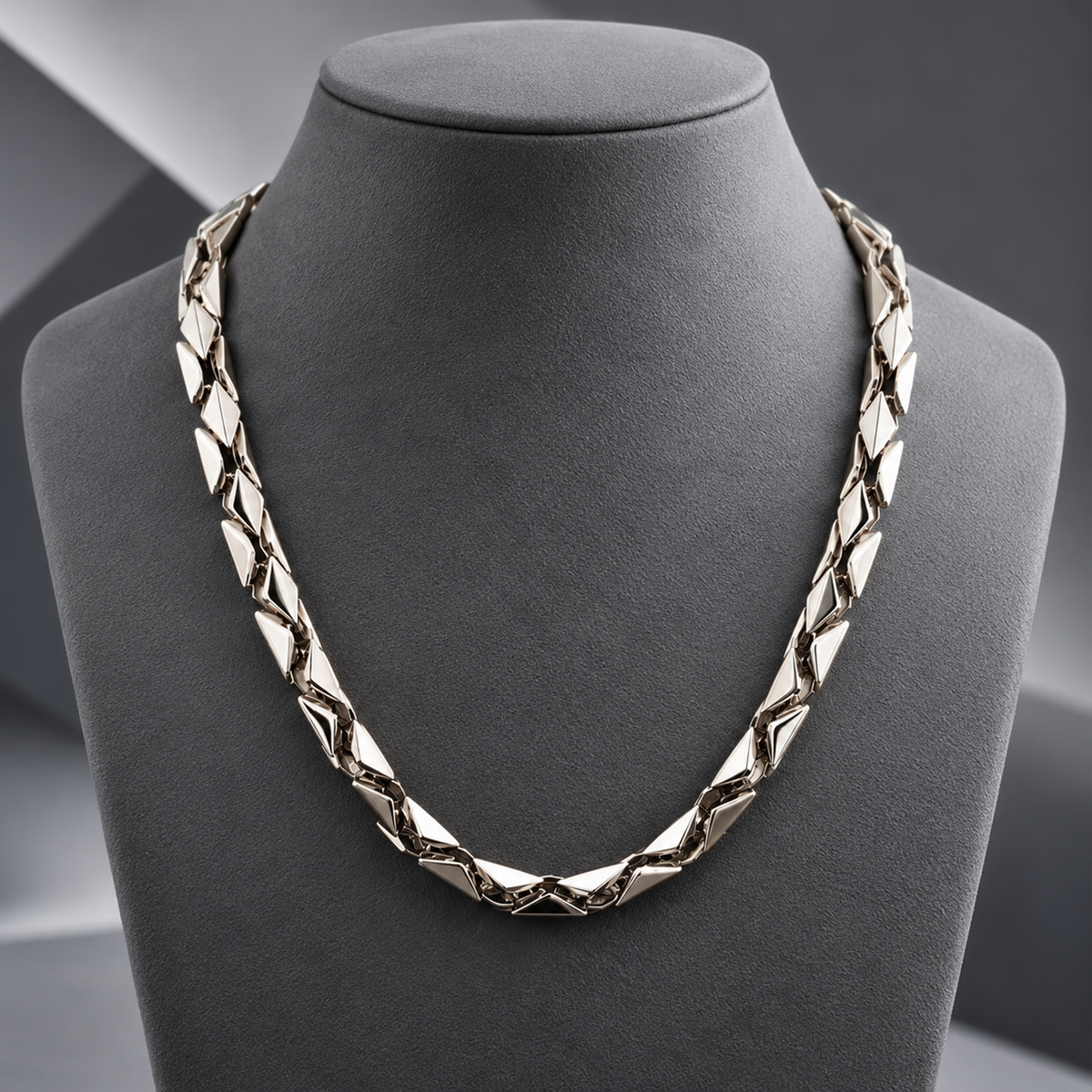Men’s platinum chain models showcasing textured geometric patterns and high-polish finish