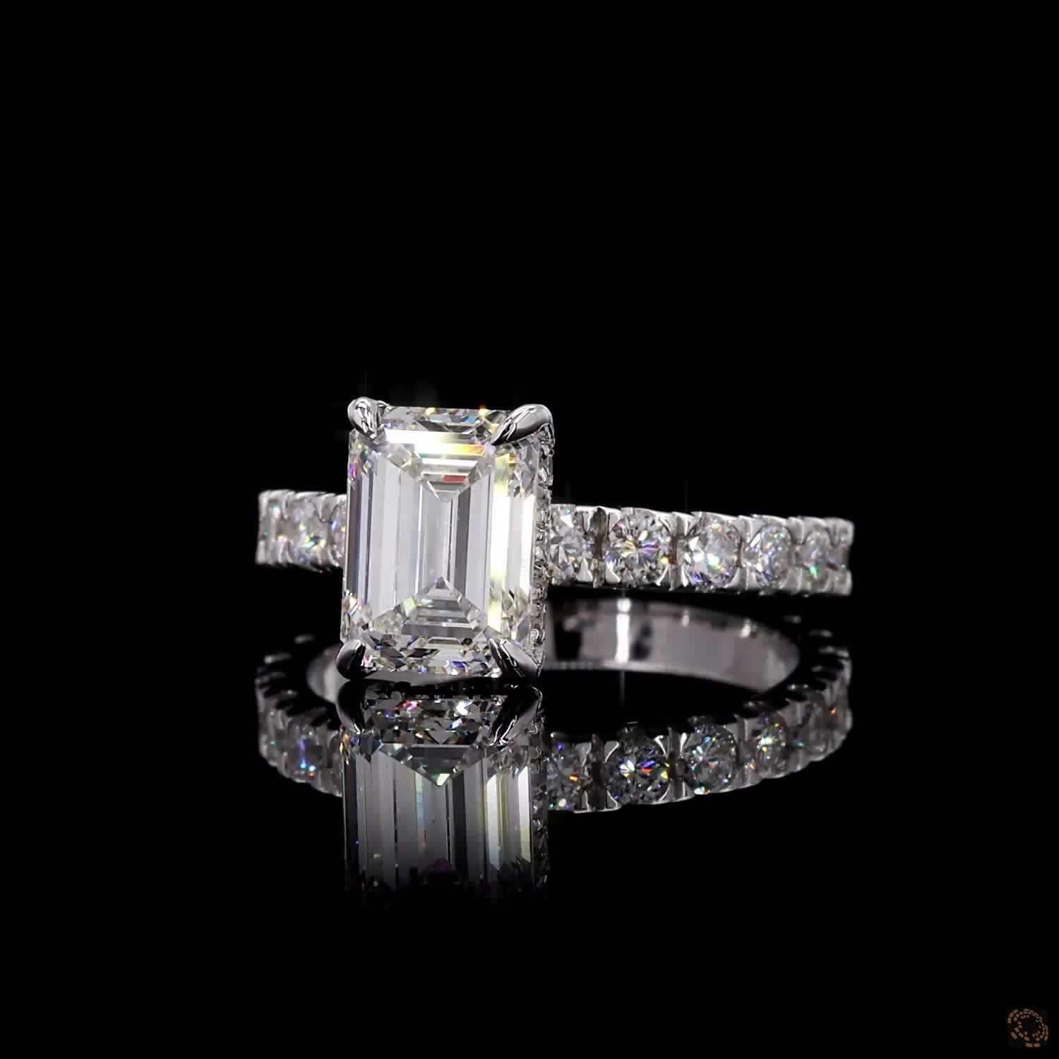 White gold lab grown diamond halo ring emerald and round cut