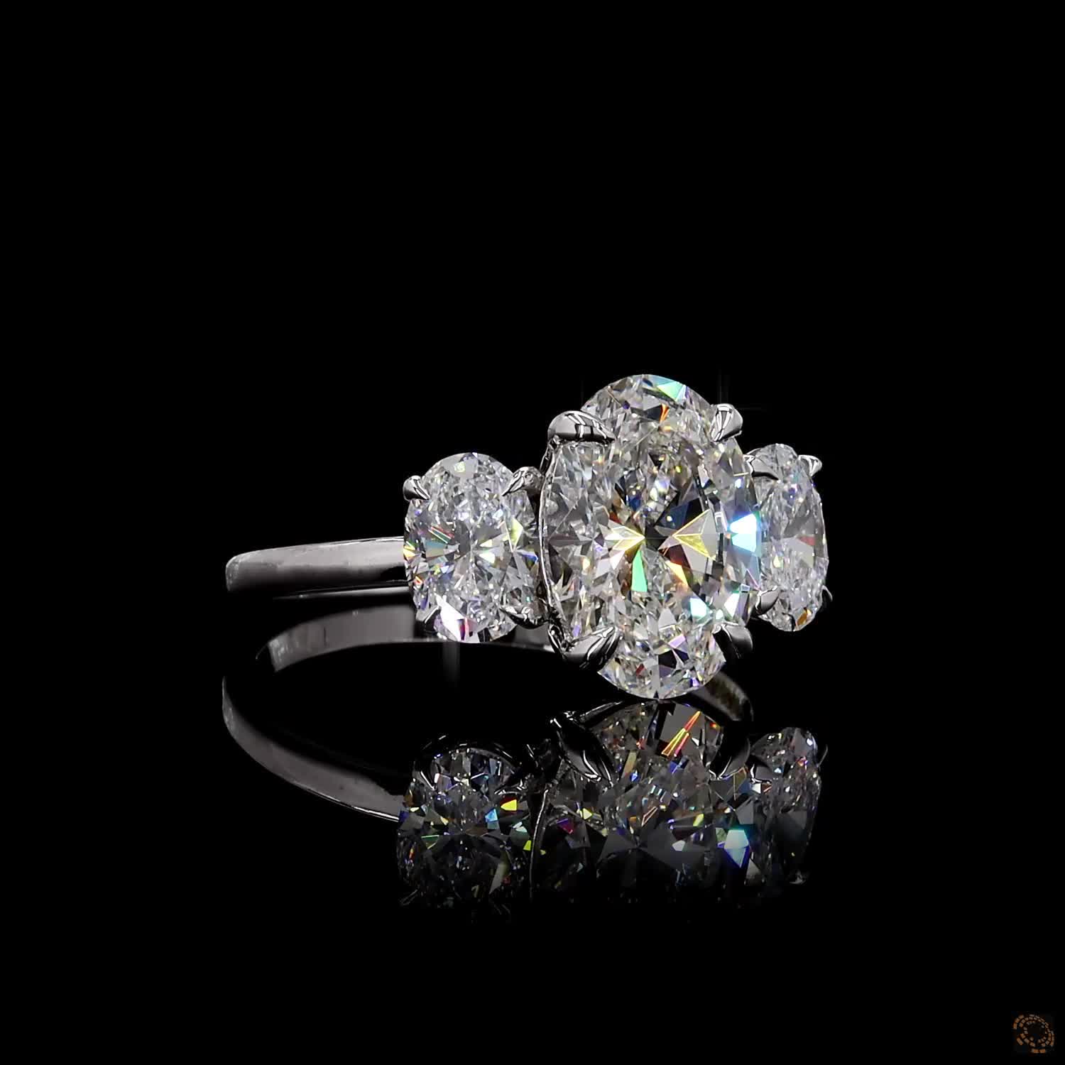 Oval cut lab grown diamond three stone ring white gold