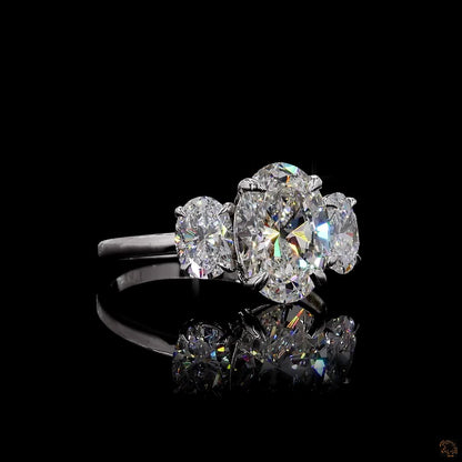 Oval cut lab grown diamond three stone ring white gold