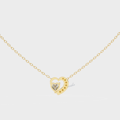 Gold heart-shaped necklace with a diamond 