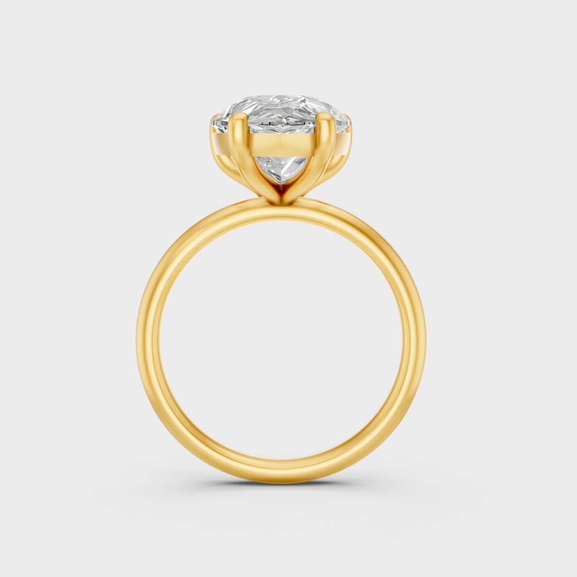 Close-Up View of 5 Ct Pear-Cut Lab-Grown Diamond Engagement Ring with warm 18K Yellow Gold band.