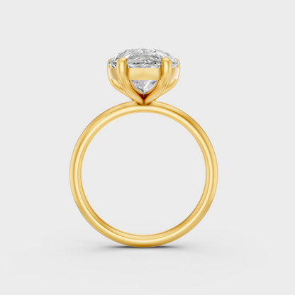 Close-Up View of 5 Ct Pear-Cut Lab-Grown Diamond Engagement Ring with warm 18K Yellow Gold band.