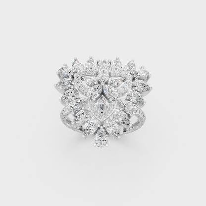 Front view of an Ethical Luxury Statement Ring with Pear, Marquise, and Round Brilliant Diamonds secured in 14K White Gold.