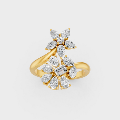 Side profile view of a Pear Emerald Round Cut Statement Ring resting on an 18K Yellow Gold Band.