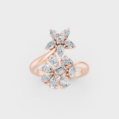 Stunning arrangement of Pear, Emerald, and Round Cut Diamonds exuding Ethical Luxury on an 18K Rose Gold Band.