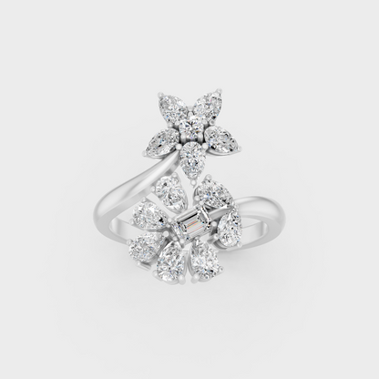 Front view of an Ethical Luxury Statement Ring with Pear, Emerald, and Round Brilliant Diamonds secured in 14K White Gold.