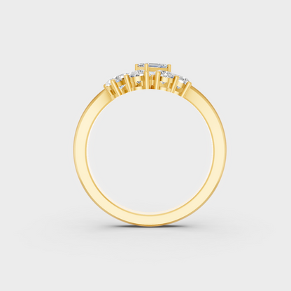 Top-down macro photo of an Ethical Luxury Mixed Shape Diamond Ring cast in classic 18K Yellow Gold.
