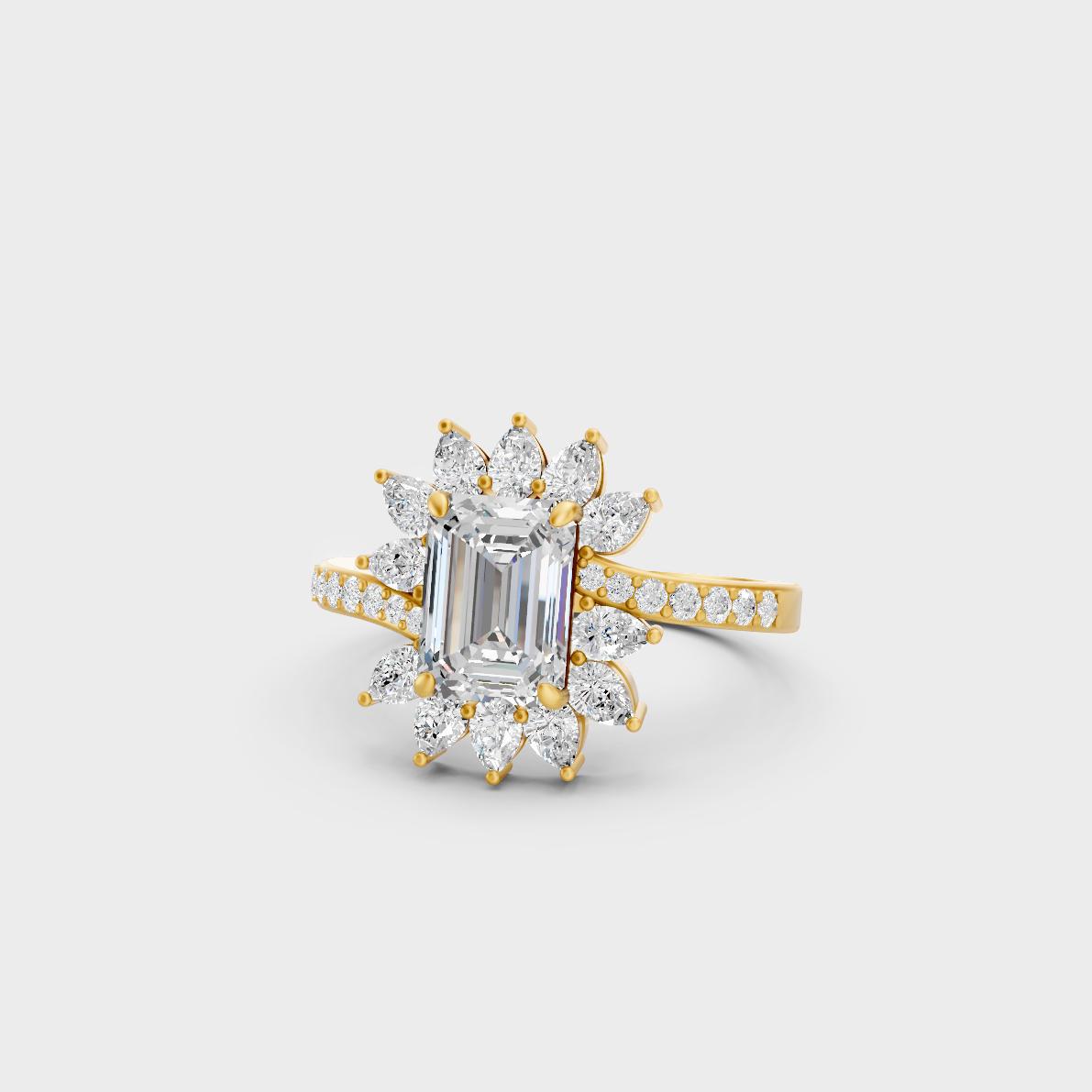 Close-up view of a 2.13 Carat Emerald, Round, and Pear Cut Lab-Grown Diamond Cocktail Ring in 14K Yellow Gold.