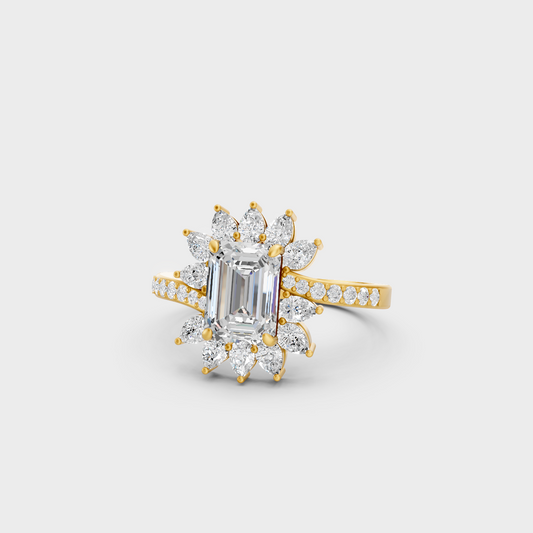 Close-up view of a 2.13 Carat Emerald, Round, and Pear Cut Lab-Grown Diamond Cocktail Ring in 14K Yellow Gold.