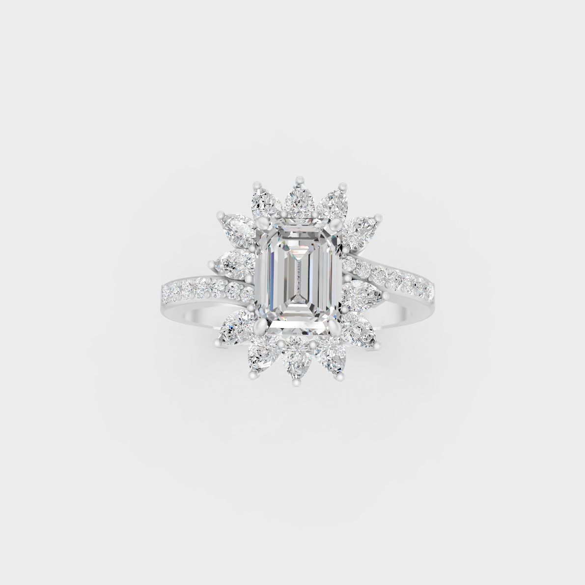 Front view of an Ethical Luxury Statement Ring with Emerald, Round, and Pear Brilliant Diamonds secured in 14K White Gold.