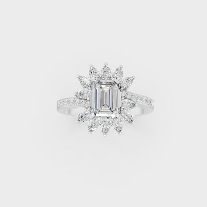Front view of an Ethical Luxury Statement Ring with Emerald, Round, and Pear Brilliant Diamonds secured in 14K White Gold.