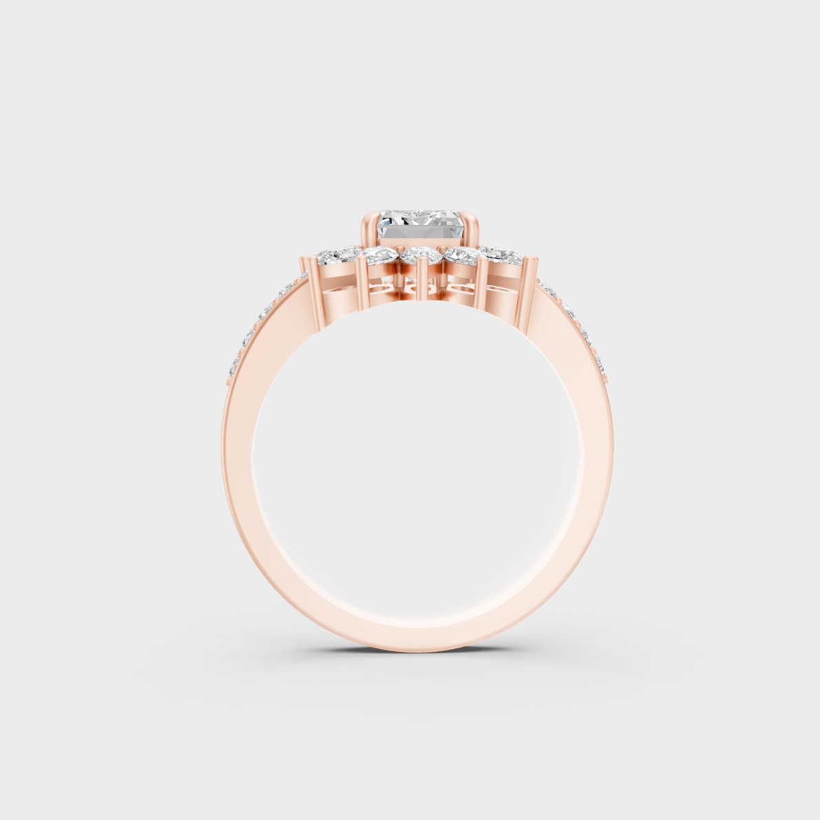 Top-down studio shot displaying the immense Brilliant Sparkle of a 2.13ct Emerald, Round, and Pear Diamond Ring in 9K Rose Gold.