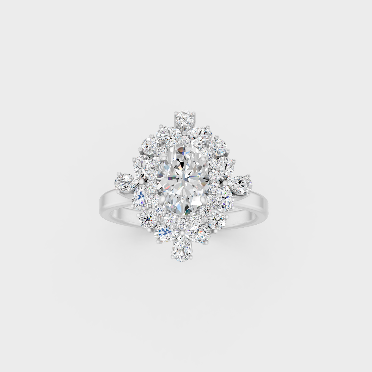 Front view of an Ethical Luxury Statement Ring with Oval, Round, and Pear Brilliant Diamonds secured in 14K White Gold.