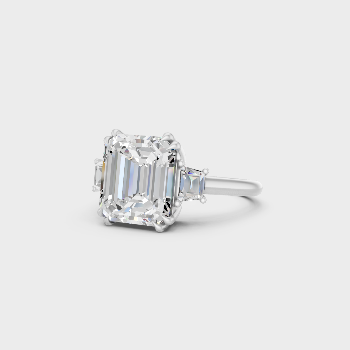Certified 4.28 Carat Emerald and Baguette-Cut Lab-Grown Diamond Three-Stone Ring in 18K White Gold.