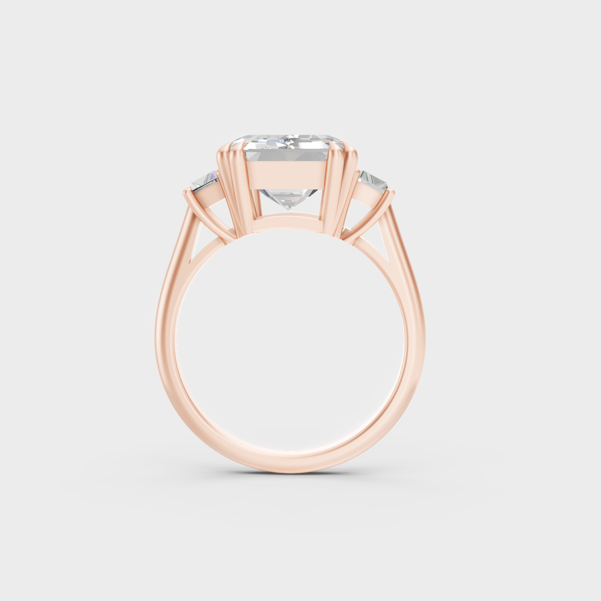 Unique 4.28 Carat Emerald and Baguette-Cut Lab-Grown Diamond Three-Stone Ring with modern appeal in 9K Rose Gold.