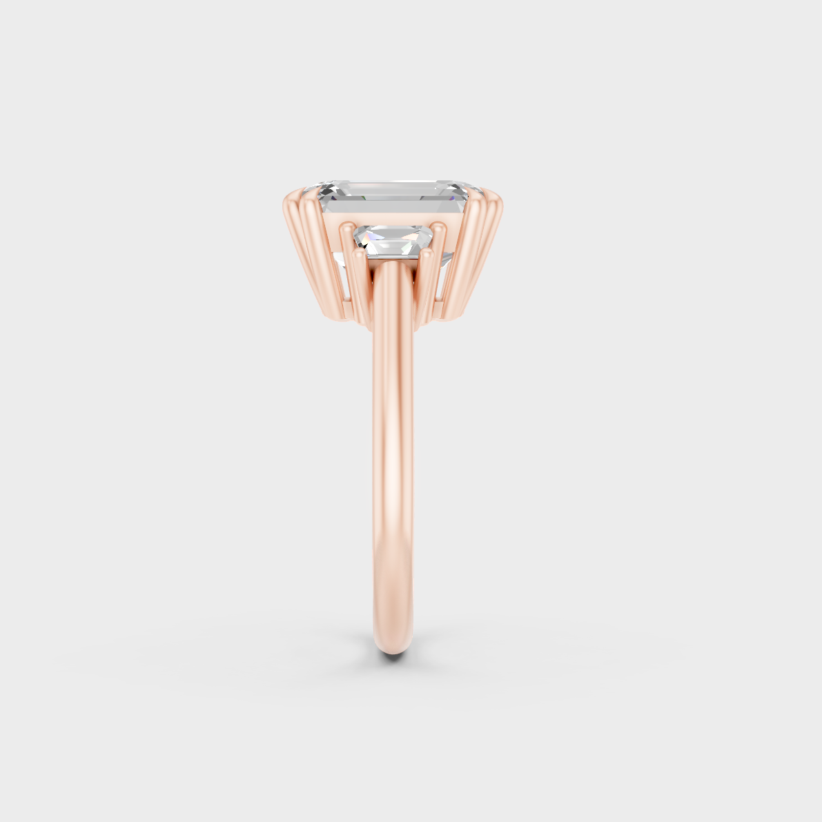 Ethical Luxury 4.28 Ct Emerald and Baguette Lab-Grown Diamond Three-Stone Ring, elegant statement in 18K Rose Gold.