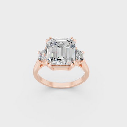 Exquisite 4.28 Ct Emerald and Baguette Lab-Grown Diamond Engagement Ring, polished 14K Rose Gold finish.