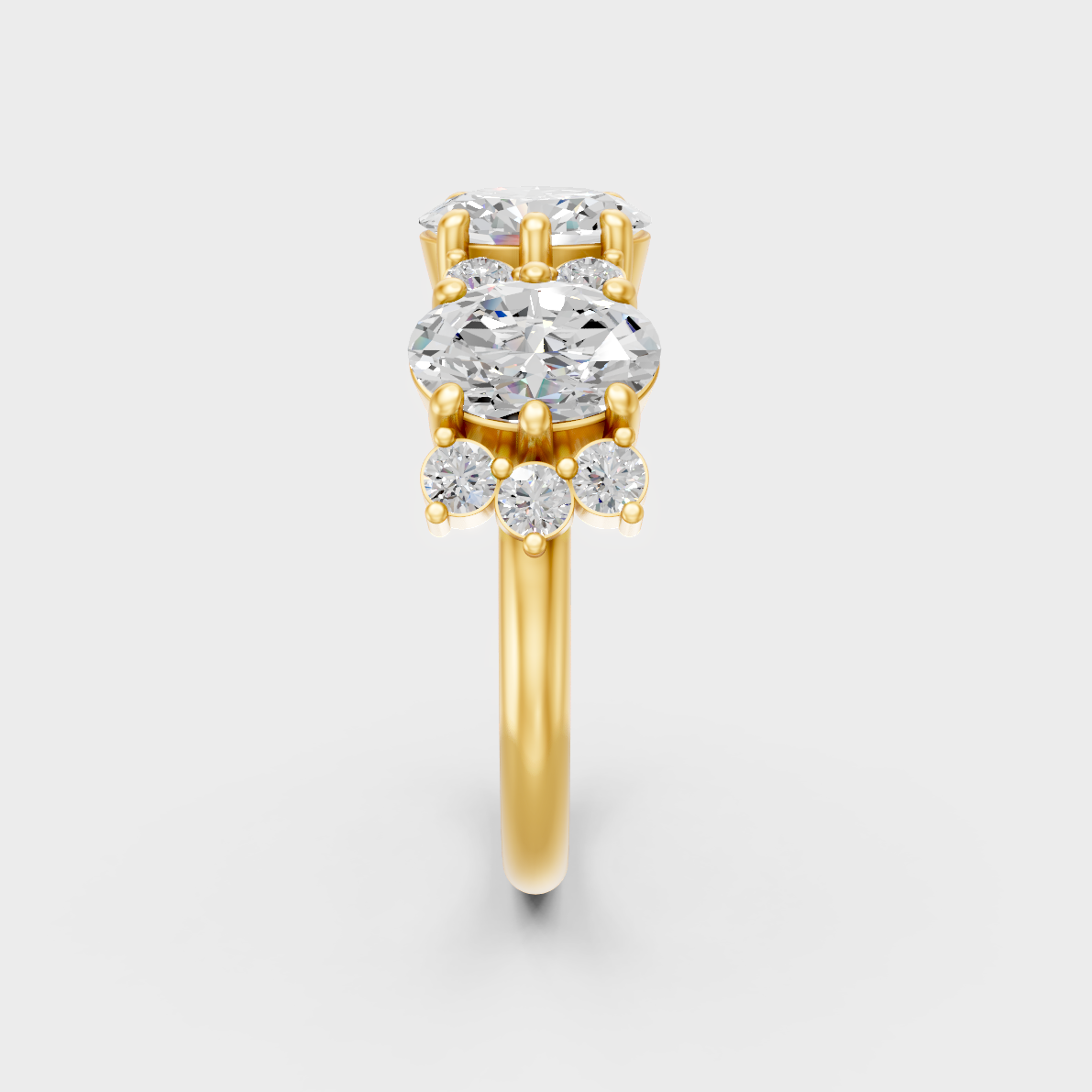 Close-Up View of 2.30 Ct Oval and Round Lab-Grown Diamond Band with warm 18K Yellow Gold band.