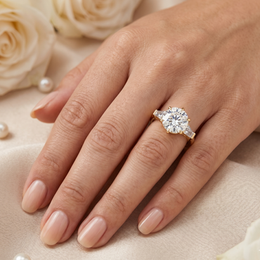 Luxury yellow gold engagement ring with a round and baguette-cut design