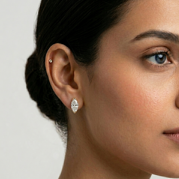 Marquise cut 1.50 carat total lab-grown diamond earrings set in 9K, 14K, 18K yellow, white, and rose gold, or 950 platinum, showcased on a model, elegant ethical luxury fine jewelry.