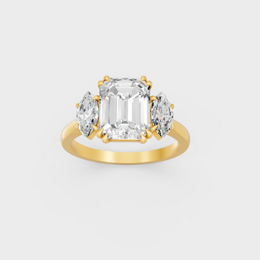 Majestic 3.14 Ct Emerald and Marquise Lab-Grown Diamond Engagement Ring in a polished 14K Yellow Gold setting.