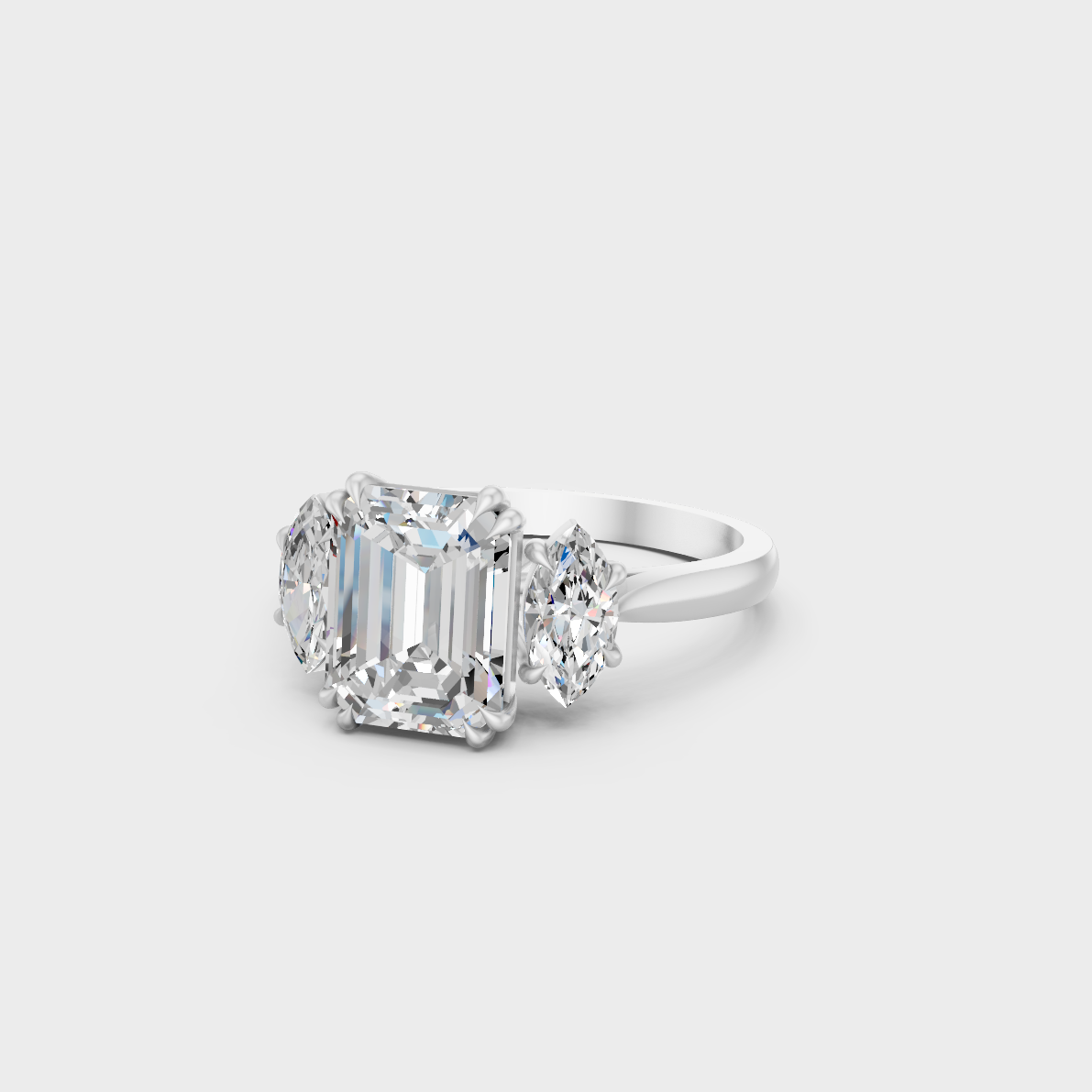 Top-Down View of 3.14 Ct Emerald and Marquise Lab-Grown Diamond Three-Stone Ring showcasing brilliant clarity in 950 Platinum.