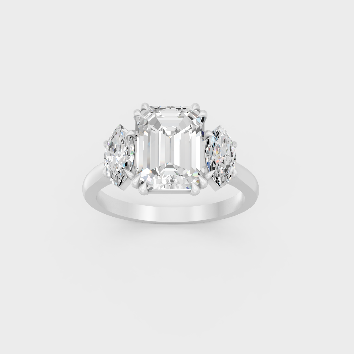 Heavyweight 3.14 Carat Emerald and Marquise Three-Stone Ring in pure 950 Platinum.