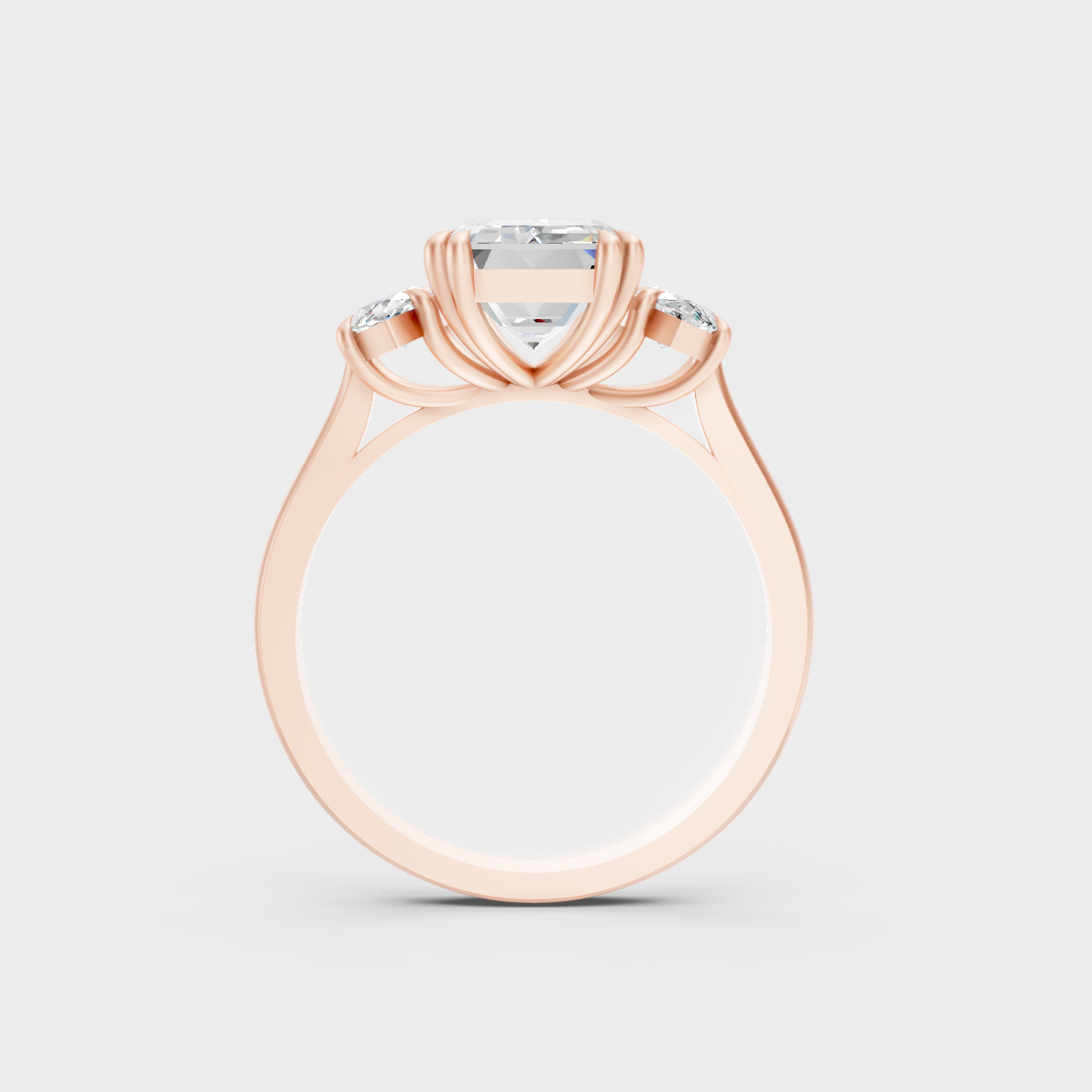 Unique 3.14 Carat Emerald and Marquise-Cut Lab-Grown Diamond Three-Stone Ring with modern appeal in 9K Rose Gold.