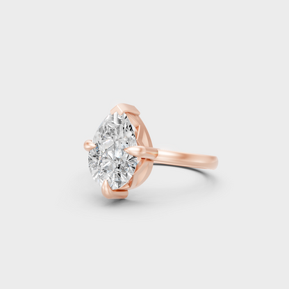 Distinctive 2 Carat Pear-Cut Lab-Grown Diamond Solitaire Ring in 18K Rose Gold.