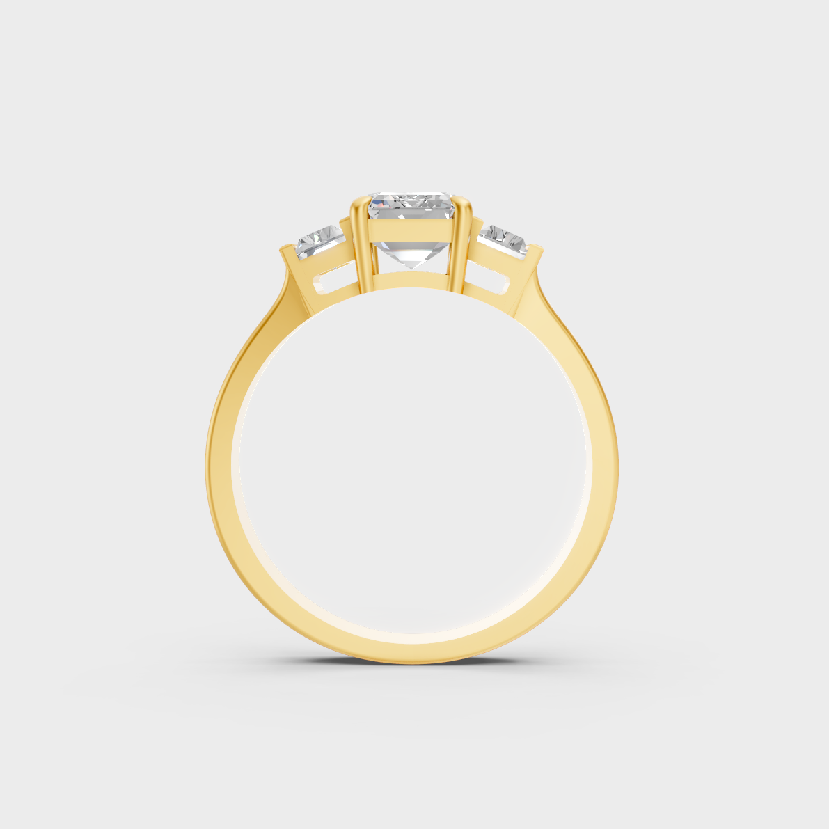 Luxury 2.2 Carat Emerald and Baguette Three-Stone Ring with architectural styling in 9K Yellow Gold.