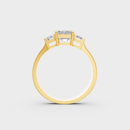 Luxury 2.2 Carat Emerald and Baguette Three-Stone Ring with architectural styling in 9K Yellow Gold.