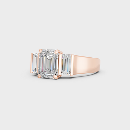 Distinctive 2.2 Carat Emerald and Baguette-Cut Lab-Grown Diamond Three-Stone Ring in 18K Rose Gold.