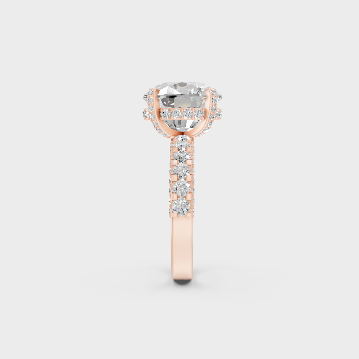 Angled profile view of 8.15ct cushion solitaire with accents ring in warm rose gold