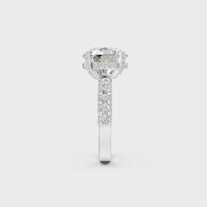 Profile view showing basket and prongs of 8.15ct cushion diamond ring in white gold